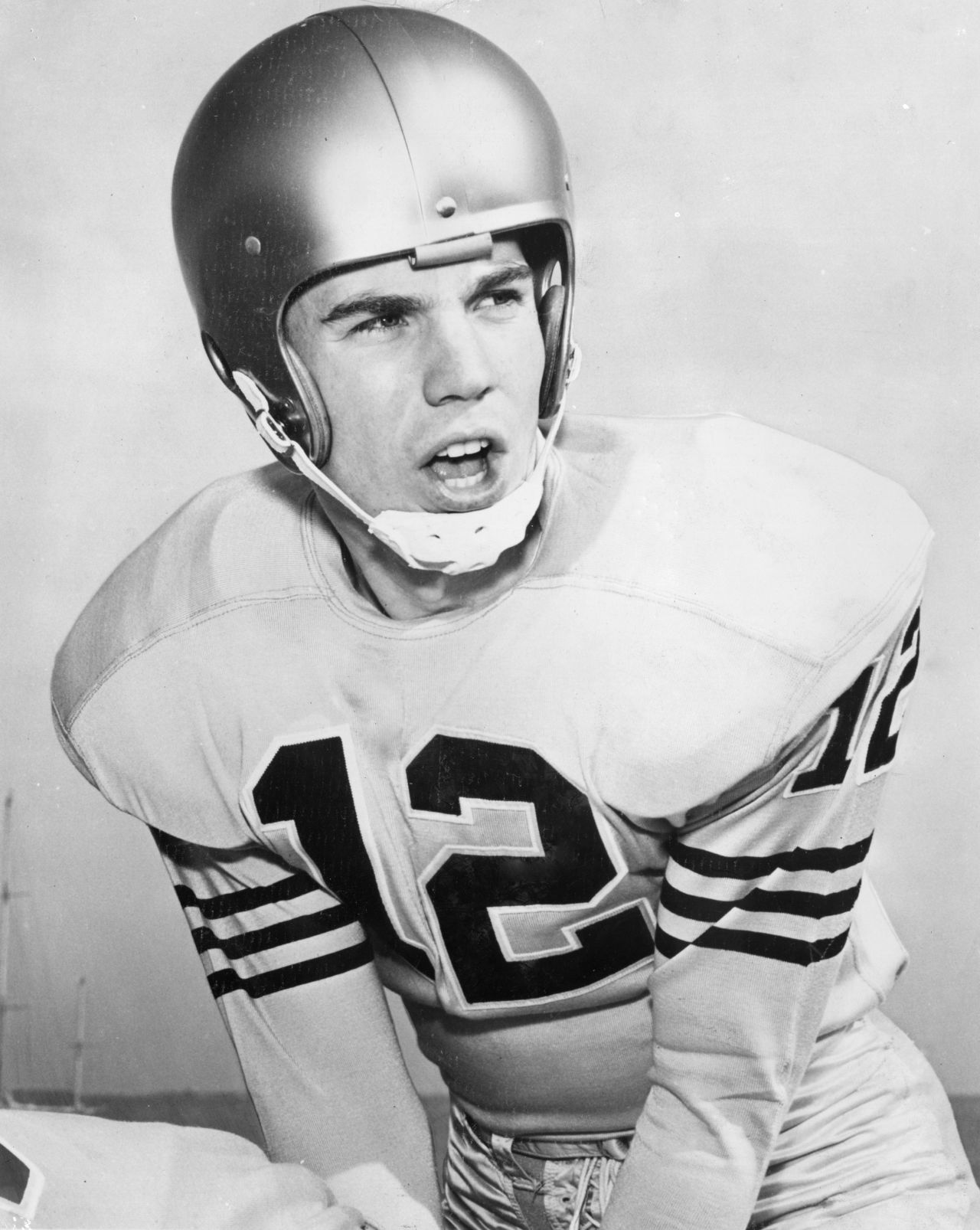 Fleet-footed quarterback Roger Staubach wore No. 12 throughout his college and pro career with Navy and the Dallas Cowboys. A slippery fellow who earned the sobriquet "Roger the Dodger," Staubach rushed for 2,264 yards and 20 touchdowns on top of his 153 passing touchdowns. The Heisman Trophy winner was drafted late in 1964 but went on to earn six Pro Bowl selections and win two Super Bowls, despite a four-year stint in the military that kept him out of the league until age 27. The NFL ranks him the 46th best player of all time. 