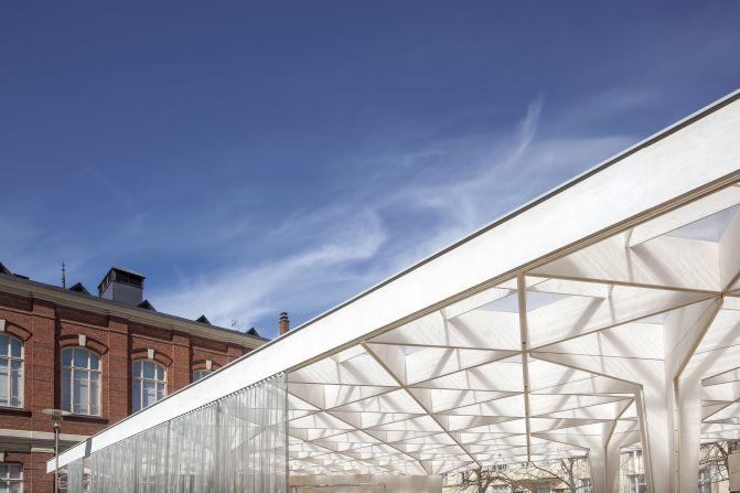 A lattice timber canopy gives a feeling of lightness to the pavilion. The structure will be recycled for a new architectural project next year.