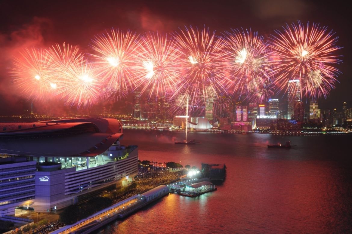 Firework's light up Hong Kong's Victoria Harbour.  This year will see the city's midnight fireworks display journey across town for the first time, beginning out at the sea and moving along Victoria Harbour to the Hong Kong Convention and Exhibition Centre in Wan Chai.