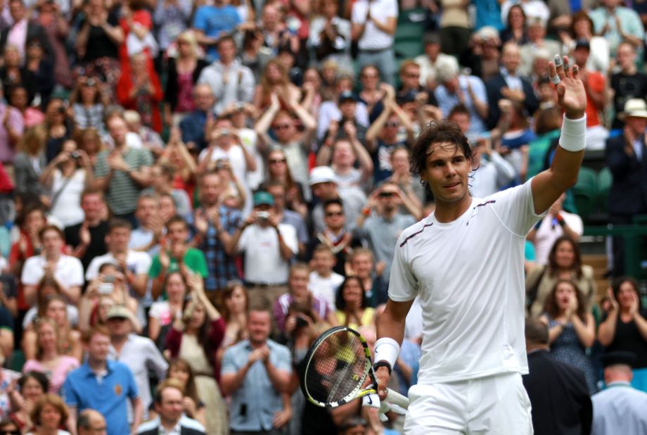 Rafael Nadal -- seen celebrating after his first round victory at Wimbledon 2012 -- says grass and clay surfaces are "a bit less aggressive on the body." A  sports physicist has presented evidence which backs up Nadal's claim. 