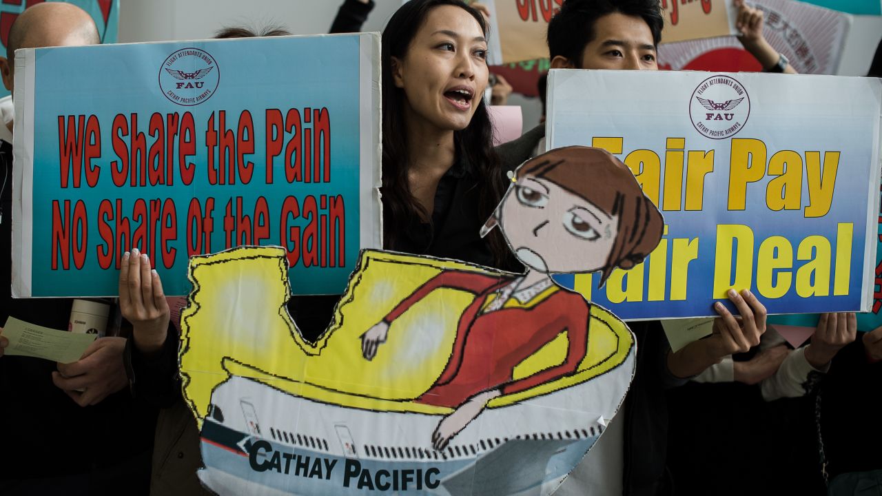 Cathay Pacific flight attendants stage a protest at the Hong Kong International Airport on December 3.