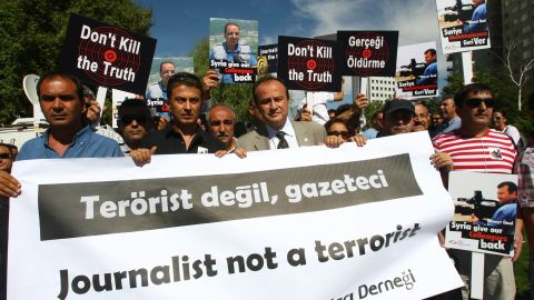 Over 100 Turkish journalists protest outside Syrian Embassy, Ankara, August 31, 2012, for two Turkish reporters' release. 