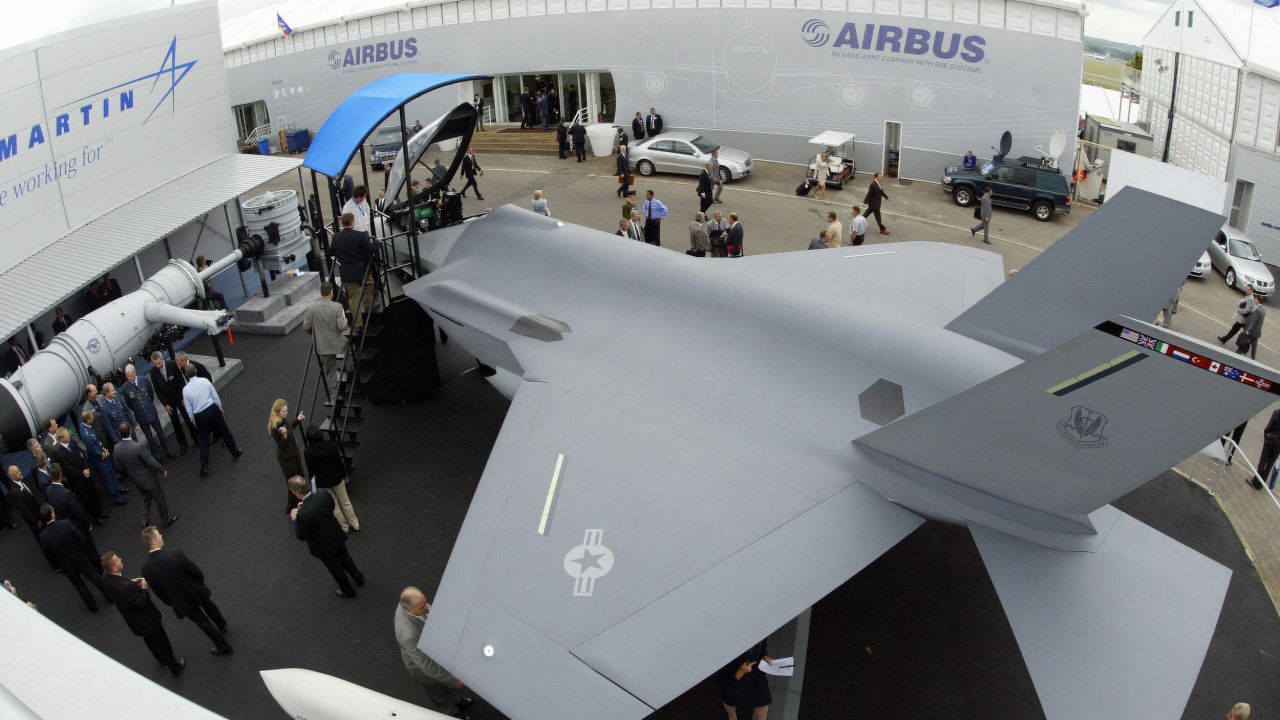 A model of the F-35 Joint Strike Fighter is on display at an airshow in 2004. The writers say it's outmoded and hugely expensive.

