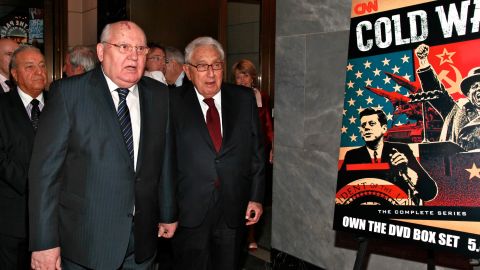 Mikhail Gorbachev and Henry Kissinger attend an event about the Cold War in April. The writers say the U.S nuclear program is based on yesteryear's Cold War ideology.