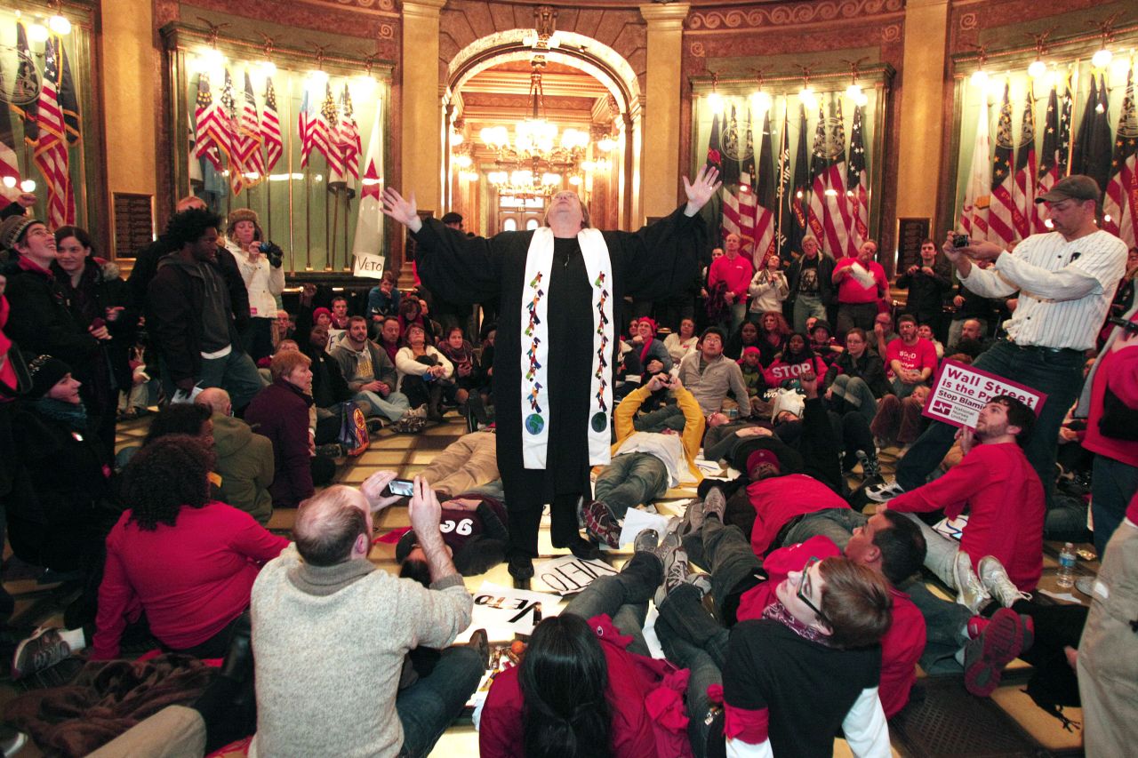 Union members hold a sit-in in the rotunda of the Michigan State Capitol as they protest the right-to-work legislation.