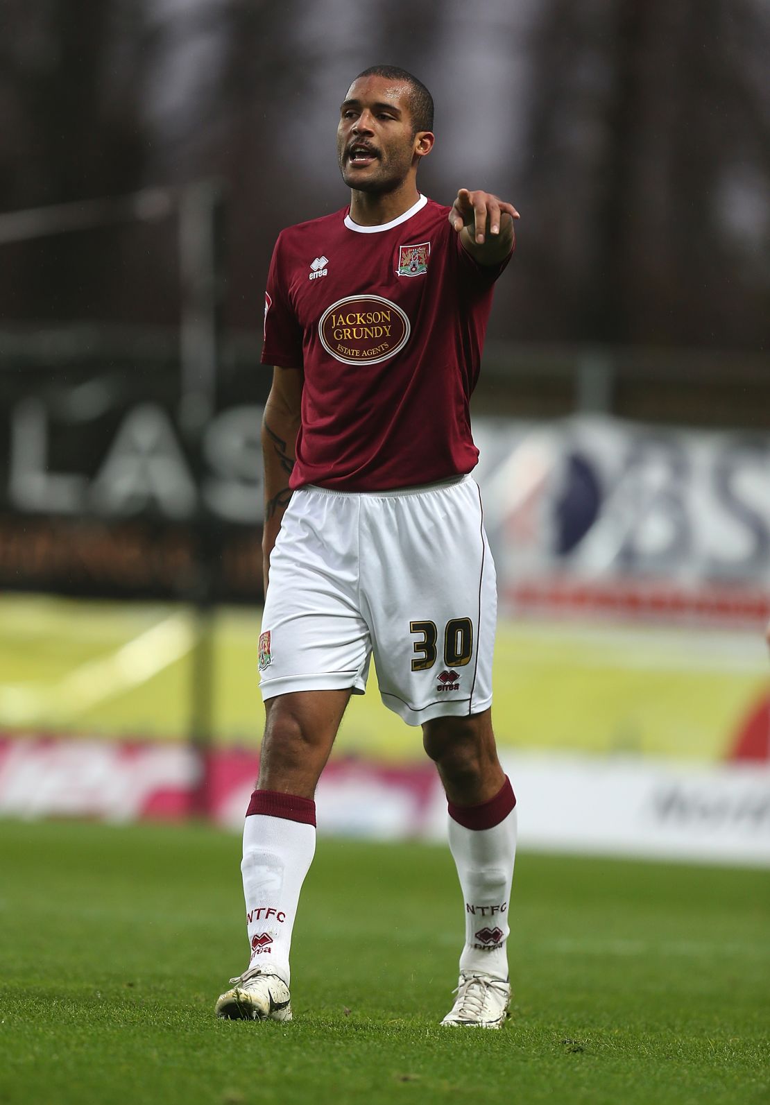 Clarke Carlisle in action playing for Northampton Town in 2012.
