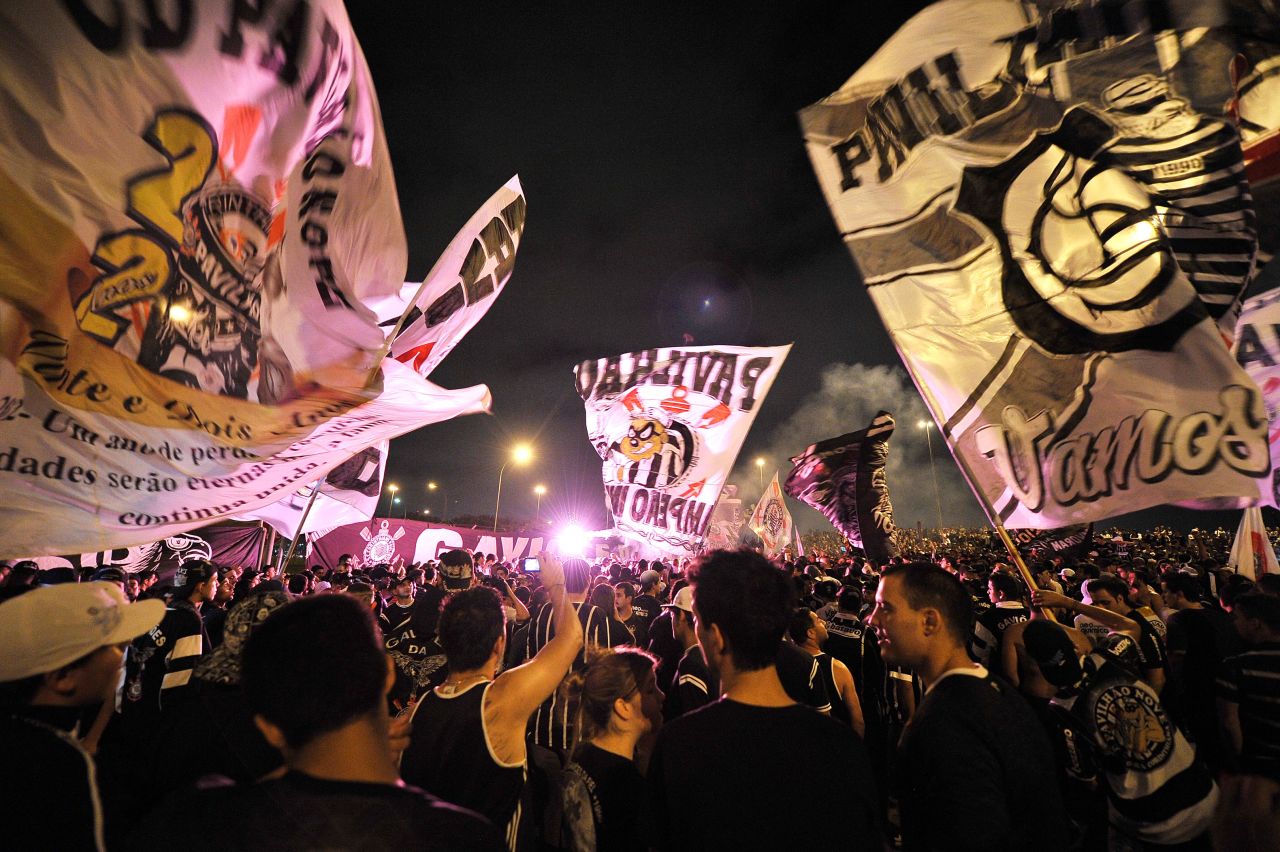 Some 15,000 Corinthians supporters waved banners, set off fireworks and blocked roads at Sao Paulo's main airport as the team set off for Japan. 