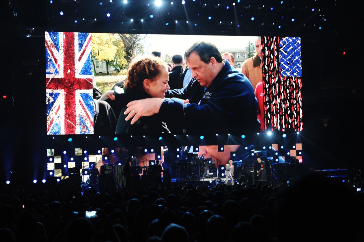 A video shows New Jersey Gov. Chris Christie speaking to a victim of Hurricane Sandy as The Who perform on stage during "12-12-12: The Concert For Sandy Relief." The 2012 concert at New York's Madison Square Garden was held to benefit The Robin Hood Relief Fund to aid the victims of Superstorm Sandy.