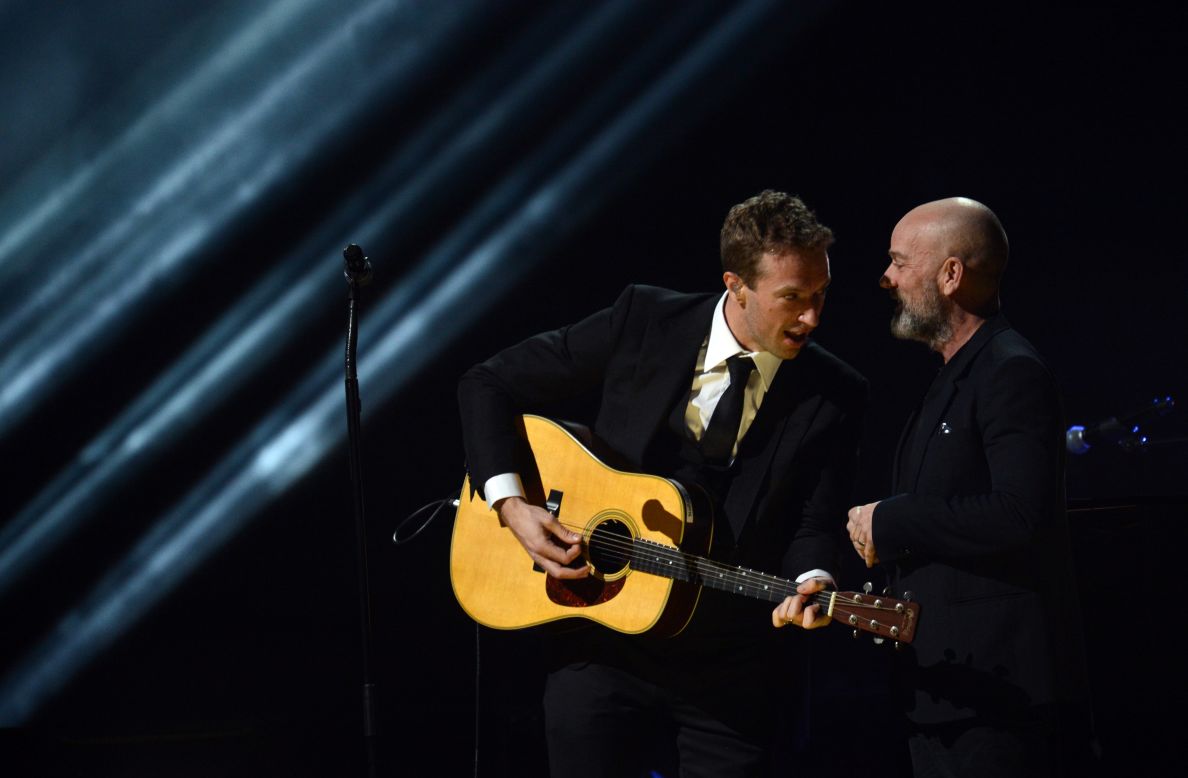 Chris Martin, left, of Coldplay and Michael Stipe of R.E.M. confer during their performance.