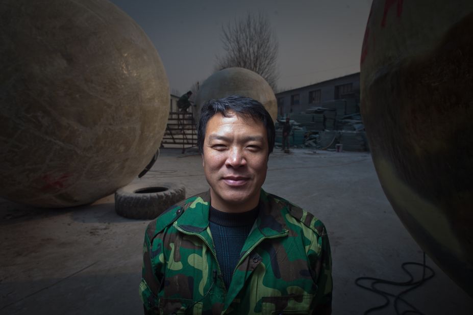 Liu stands among his pods, which he built in his yard in the village of Qiantun in China's Hebei province.