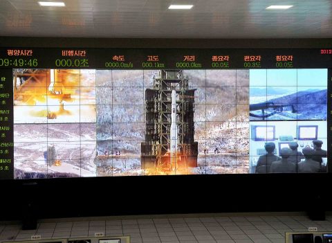 The Wednesday morning launch is seen from multiple angles on a large screen at the satellite control center in Cholsan County.