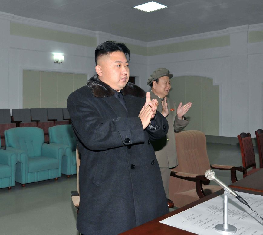 Kim rises to applaud the successful launch, a big technological victory for North Korea in the wake of an embarrassing failed launch in April.