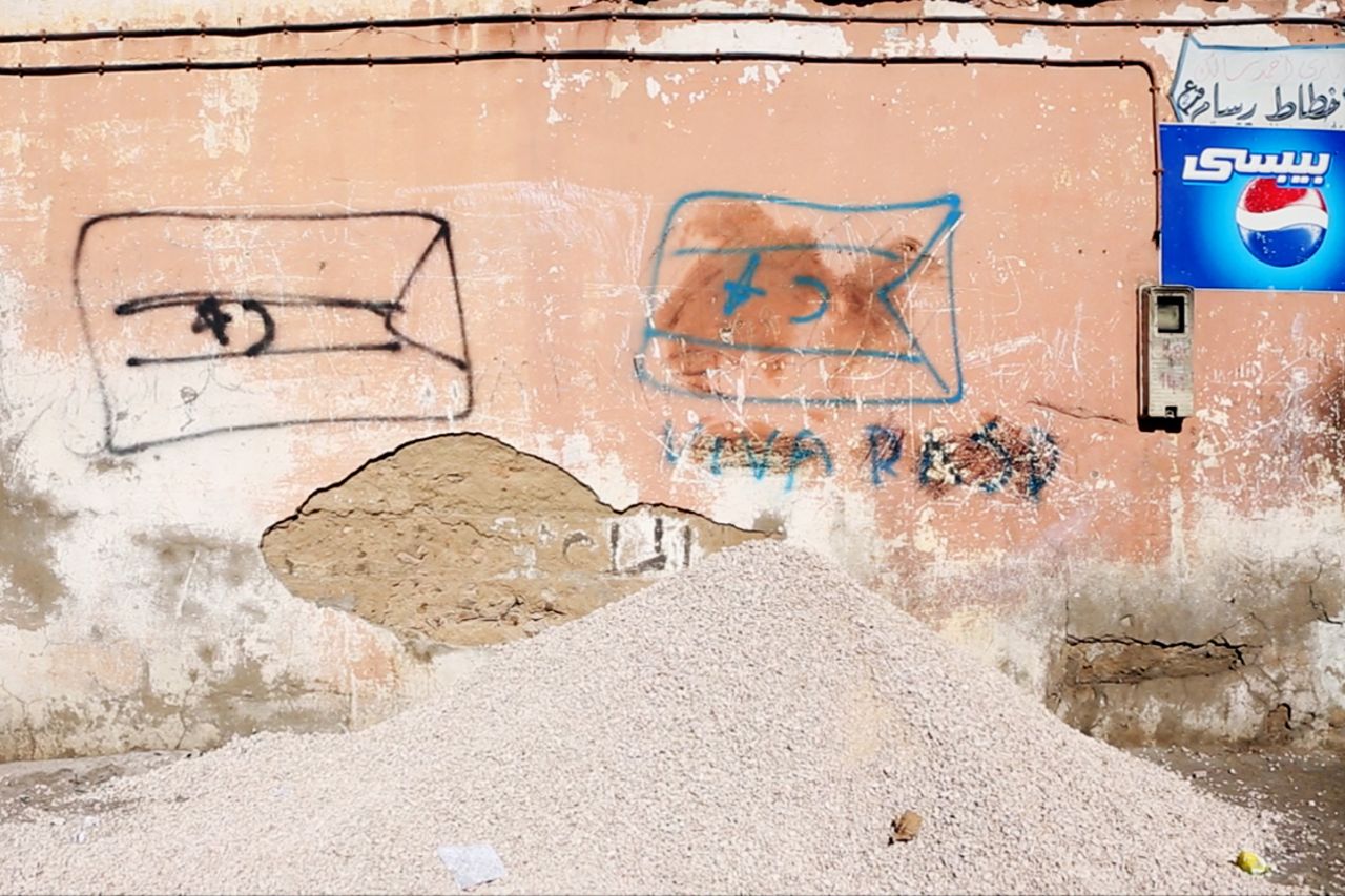 Graffiti of pro-Sahrawi independence flags on a street in Laayoune, the main city of Western Sahara. The city is in the region of the territory administered by Morocco.