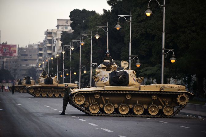 Egyptian army tanks are deployed outside the presidential palace in Cairo on Thursday, December 13. Egypt's crisis showed no sign of easing as the army delayed unity talks meant to ease political divisions and the opposition set near-impossible demands for taking part in a looming constitutional referendum.