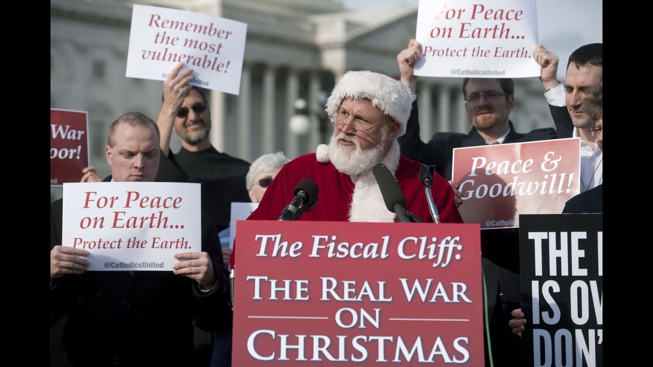Catholics United hold a press conference with Santa Claus in front of the U.S. Capitol to rebut the GOP's budget effort in the ongoing fiscal cliff argument on December 12 in Washington.