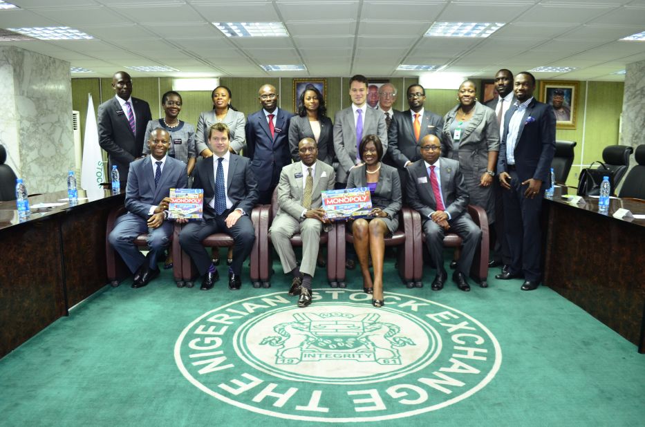 Nimi Akinkugbe (second from right, bottom row,) presenting the City of Lagos edition of Monopoly to the chief executive and directors of the Nigerian Stock Exchange earlier this week. She says the game is aiming to promote the city's history and landmark sites, but also to educate people about laws that are often overlooked.