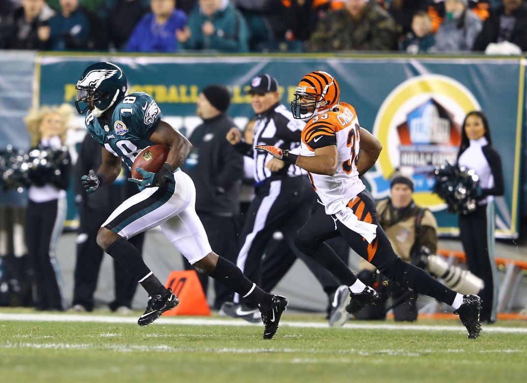 Jeremy Maclin of the Philadelphia Eagles runs after making a catch while he is pursued by Chris Crocker of the Cincinnati Bengals during their game on December 13.