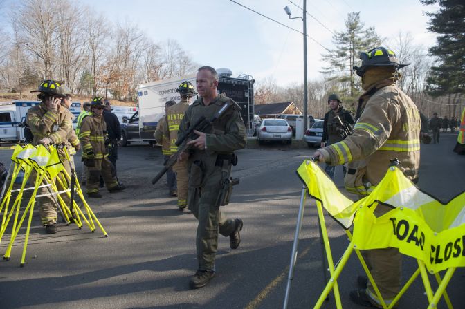 Connecticut State Police secure the scene of the shooting on December 14.