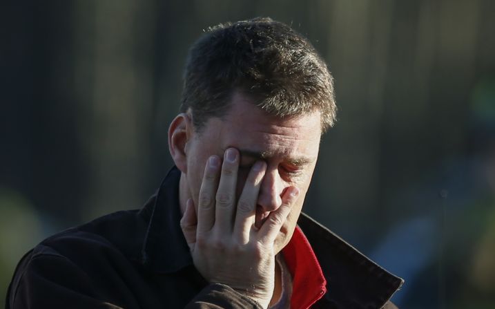 A man takes in the scene near Sandy Hook Elementary School on December 14.