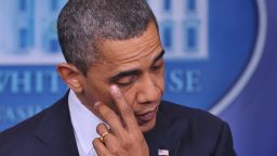 President Barack Obama wipes his eye as he speaks in the Brady Briefing Room of the White House about the Sandy Hook Elementary School shooting on December 14.