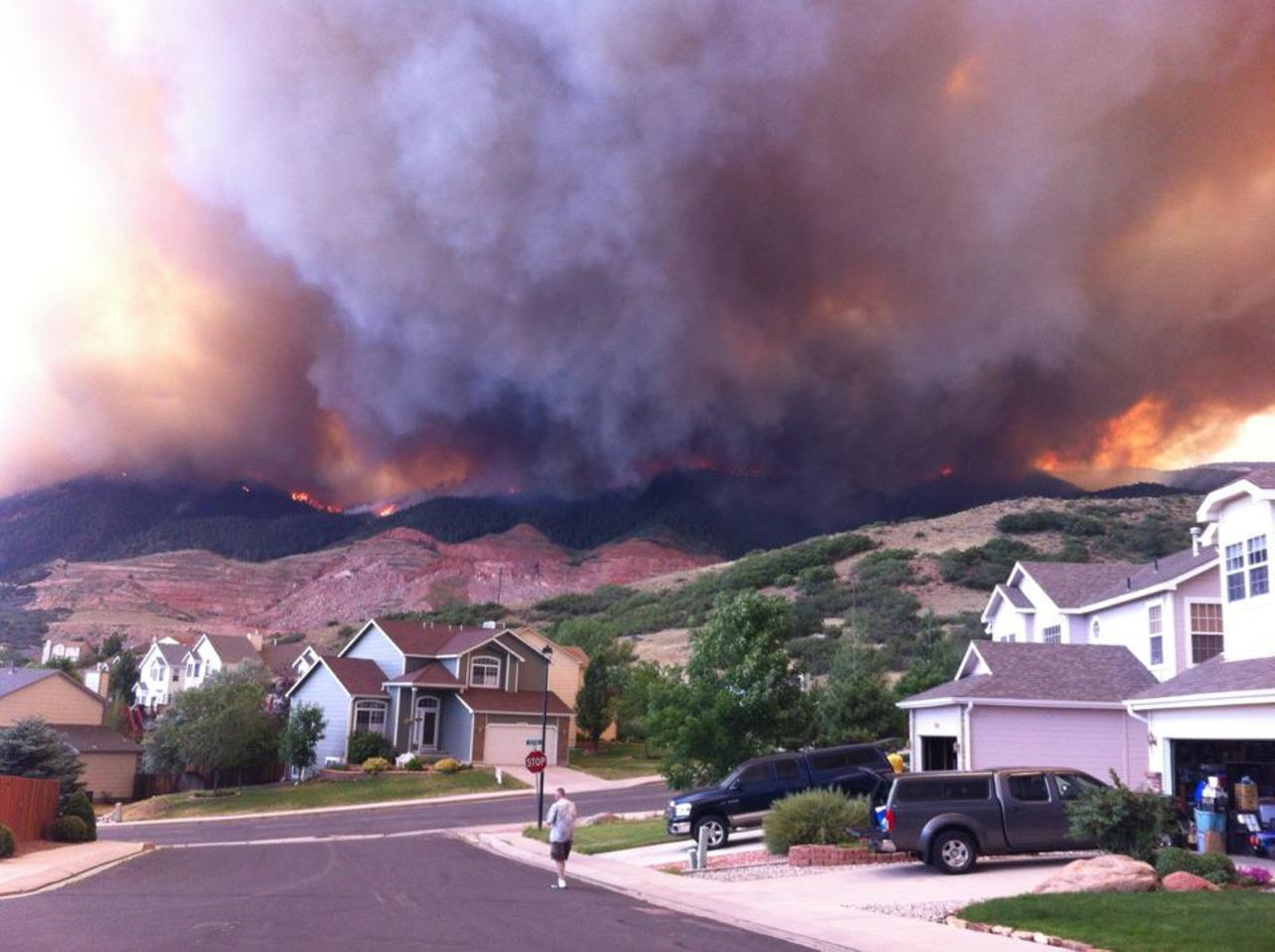 Wildfires burning in the foothills of the <a href="http://ireport.cnn.com/docs/DOC-807852">Colorado Springs mountains </a>blanketed a nearby neighborhood with pitch-black smoke in June. "We ran outside and saw the side of the foothills getting engulfed by flames coming down on either sides of the quarry," said photographer Michael Kennedy. "Our subdivision quickly deteriorated into a war zone with police cars coming into the neighborhood with loud speakers announcing 'leave the area, under mandatory evacuation.'"