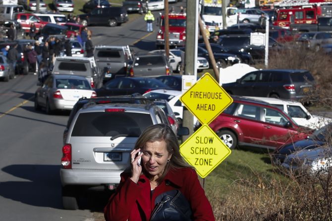 A woman weeps near Sandy Hook Elementary School on December 14.