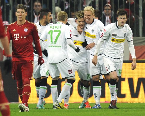 Thorben Marx celebrates his teammates after giving the visitors a 21st-minute lead, dampening the Bayern fans' prematch party mood.