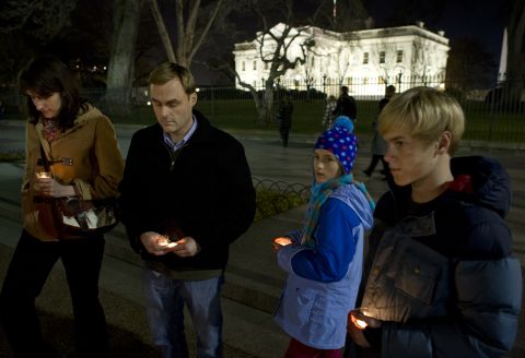 People gather for a vigil outside the White House in Washington following the Connecticut elementary school shooting on Friday.