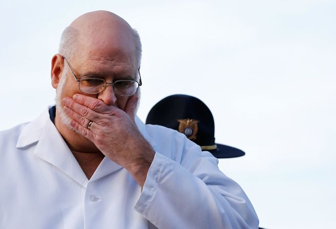 Connecticut Chief Medical Examiner H. Wayne Carver II talks to the media about the elementary school shooting during a press conference at Treadwell Memorial Park on December 15.