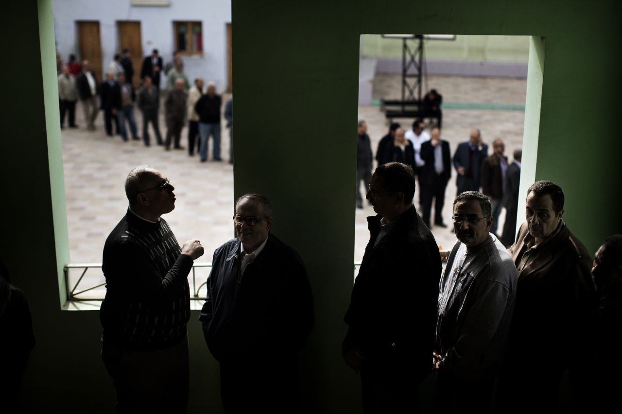Egyptian voters queue at a polling station in central Cairo on December 15, 2012 to vote on a new constitution supported by the ruling Islamists but bitterly contested by a secular-leaning opposition.