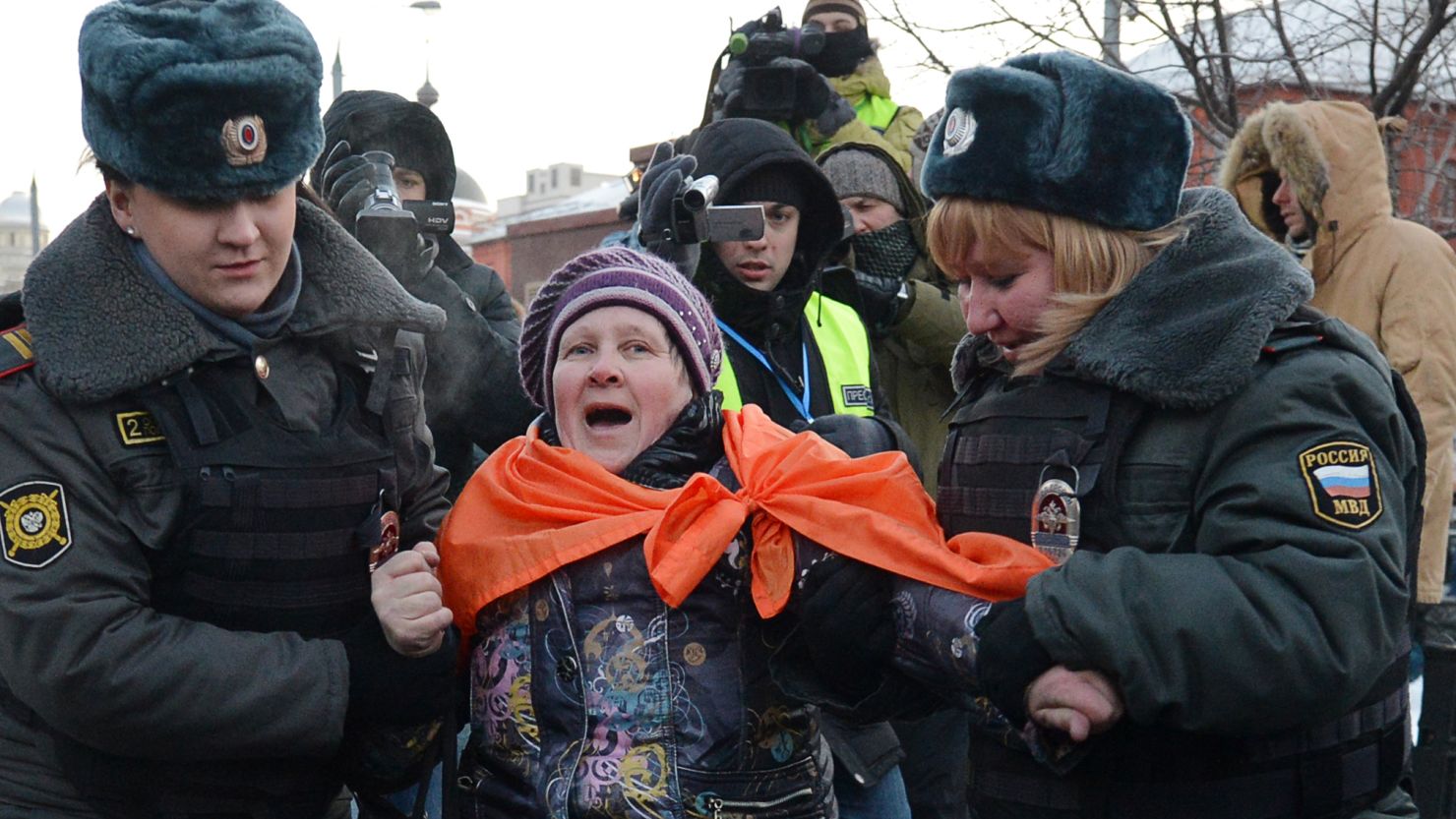 Russian police officers arrest an activist on December 15, 2012 in Moscow.