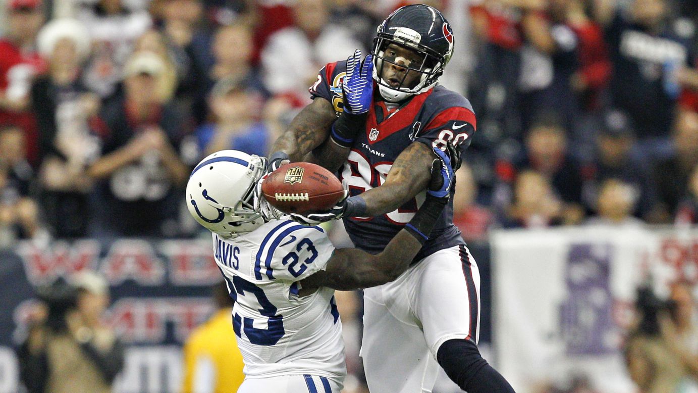 Andre Johnson of the Houston Texans goes up over Vontae Davis of the Indianapolis Colts for a reception in the first half on Sunday in Houston. 