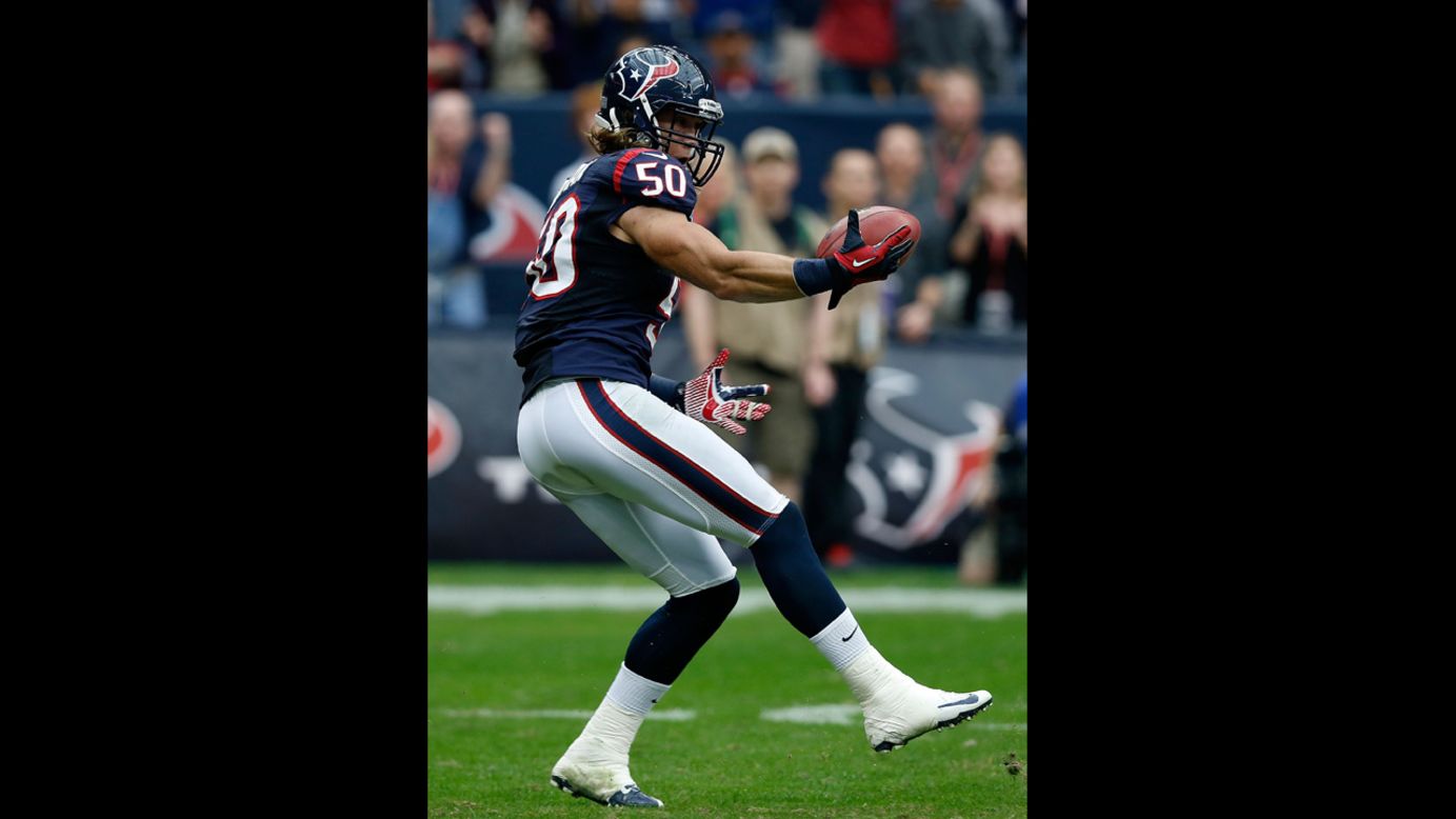 Bryan Braman of the Texans reaches for the ball on the way to an eight-yard return of a blocked punt for a first half touchdown against the Colts on Sunday.