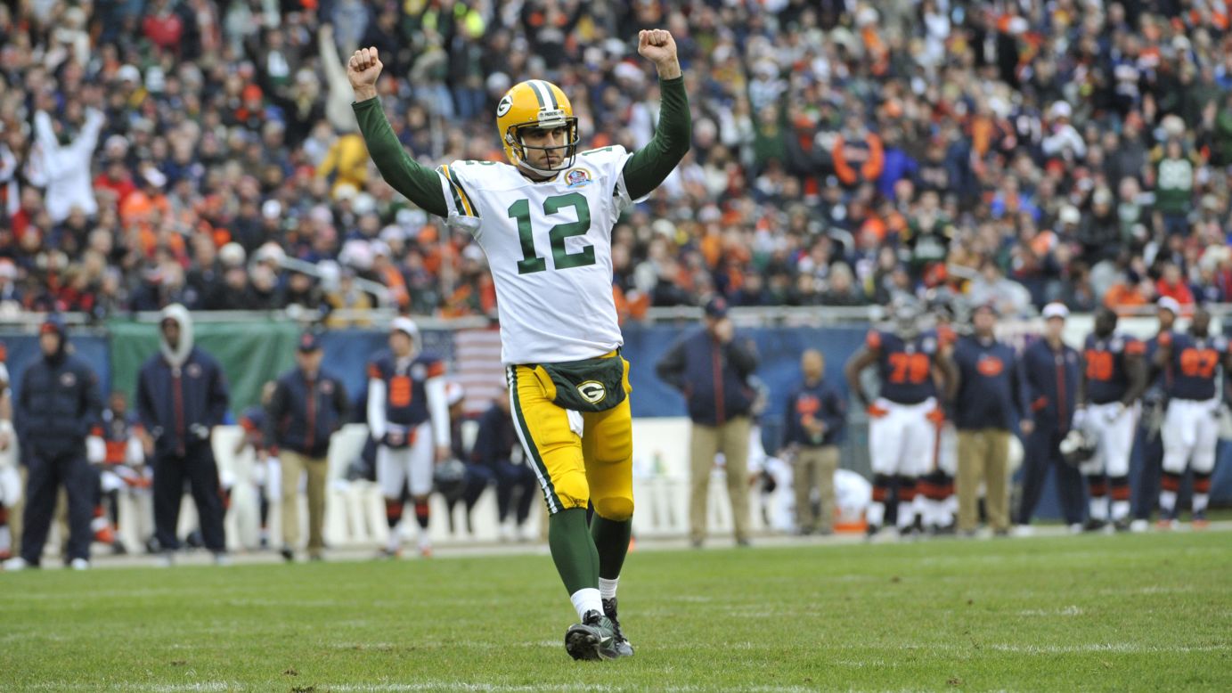 Aaron Rodgers of the Green Bay Packers reacts after throwing a touchdown pass against the Chicago Bears on Sunday at Soldier Field in Chicago.