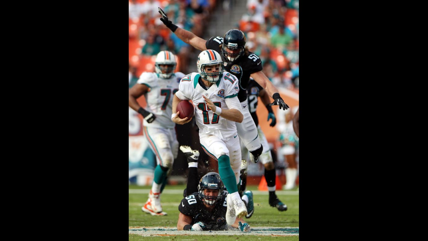 Quarterback Ryan Tannehill of the Dolphins scrambles against the Jaguars on Sunday.