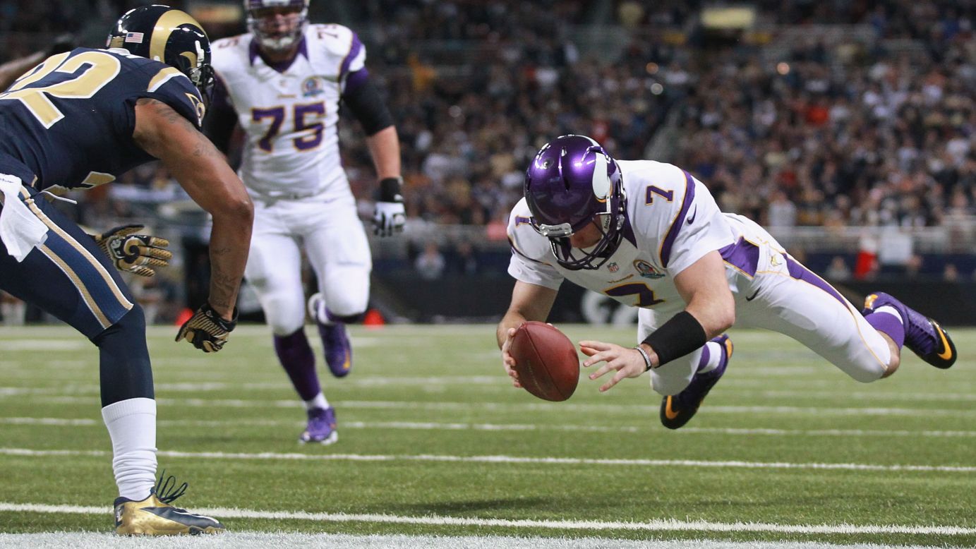 Christian Ponder of the Minnesota Vikings scores a touchdown against the St. Louis Rams at the Edward Jones Dome on Sunday in St. Louis, Missouri. 
