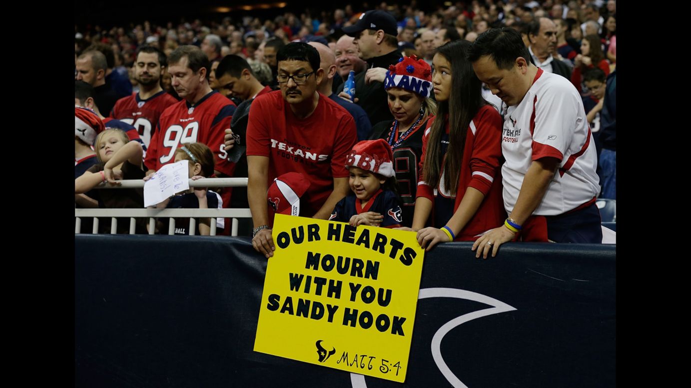 Texans fans take a moment to remember the victims of a massacre at Sandy Hook Elementary School in Newtown, Connecticut prior to the start of the game against the Colts on Sunday.