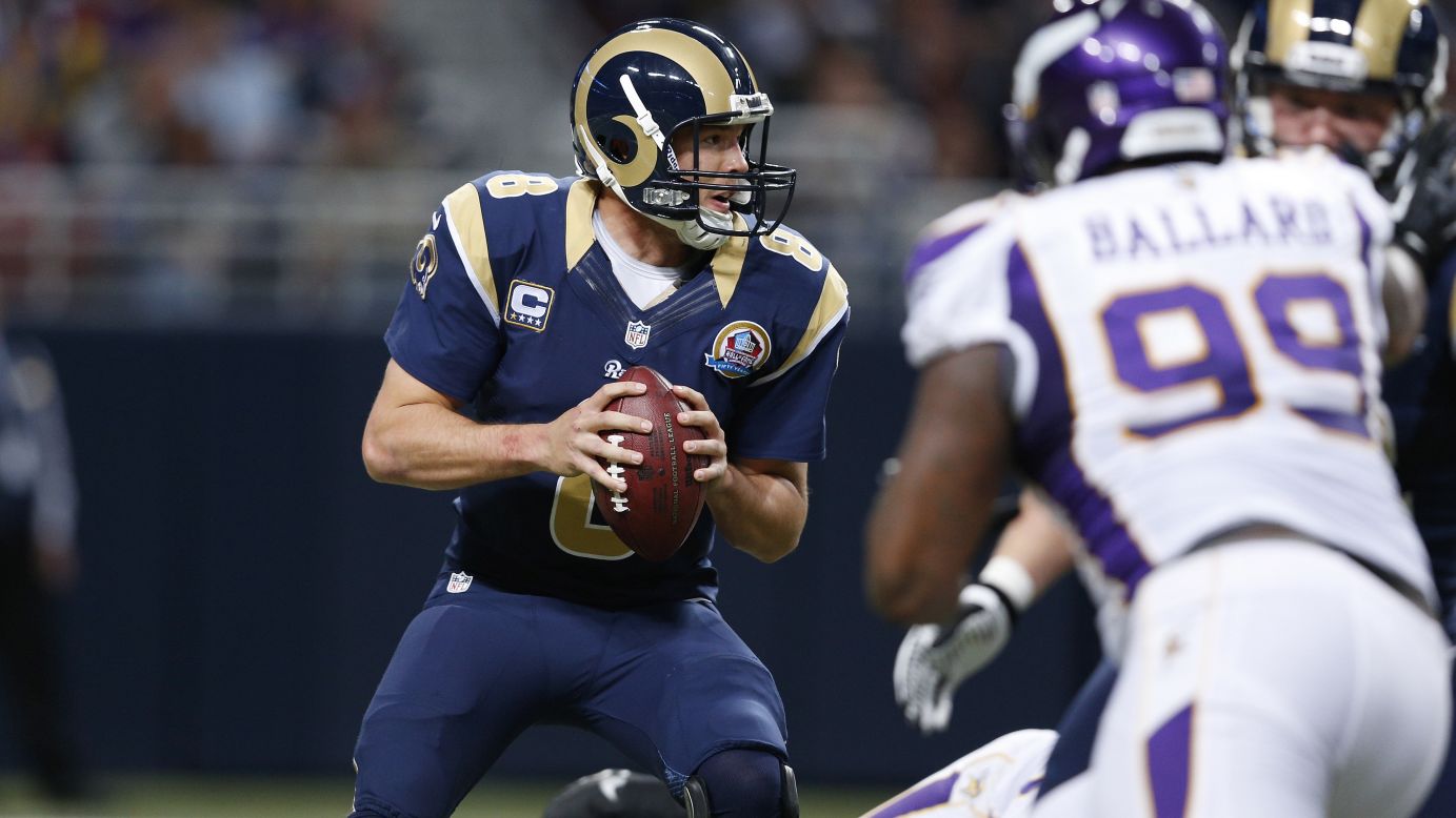 Sam Bradford of the Rams looks to pass the ball against the Vikings on Sunday.