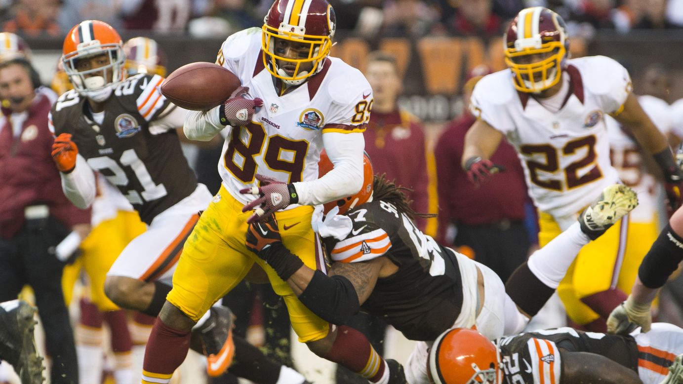 Wide receiver Santana Moss of the Redskins fumbles the ball during the second half against the Browns on Sunday.
