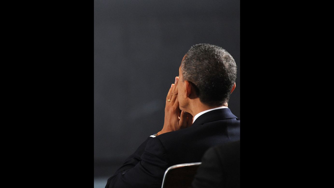 President Barack Obama waits to speak at an interfaith vigil for the shooting victims from Sandy Hook Elementary School December 16 at Newtown High School.