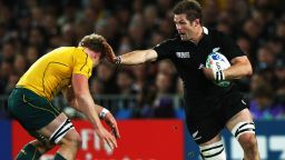 Richie McCaw of the All Blacks hands off David Pocock of the Wallabies during semi final two of the 2011 IRB Rugby World Cup between New Zealand and Australia at Eden Park on October 16, 2011 in Auckland, New Zealand.