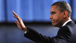 U.S. President Barack Obama waves as he arrives at the memorial service.