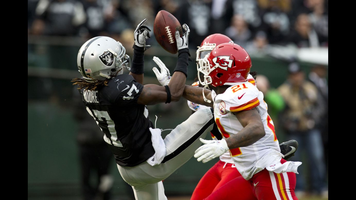 Cornerback Javier Arenas of the Chiefs breaks up a pass intended for wide receiver Denarius Moore of the Raiders during the second quarter on Sunday.