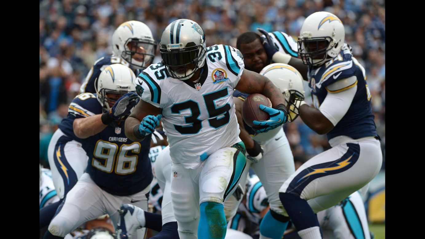 Mike Tolbert of the Panthers runs the ball against the Chargers on Sunday.