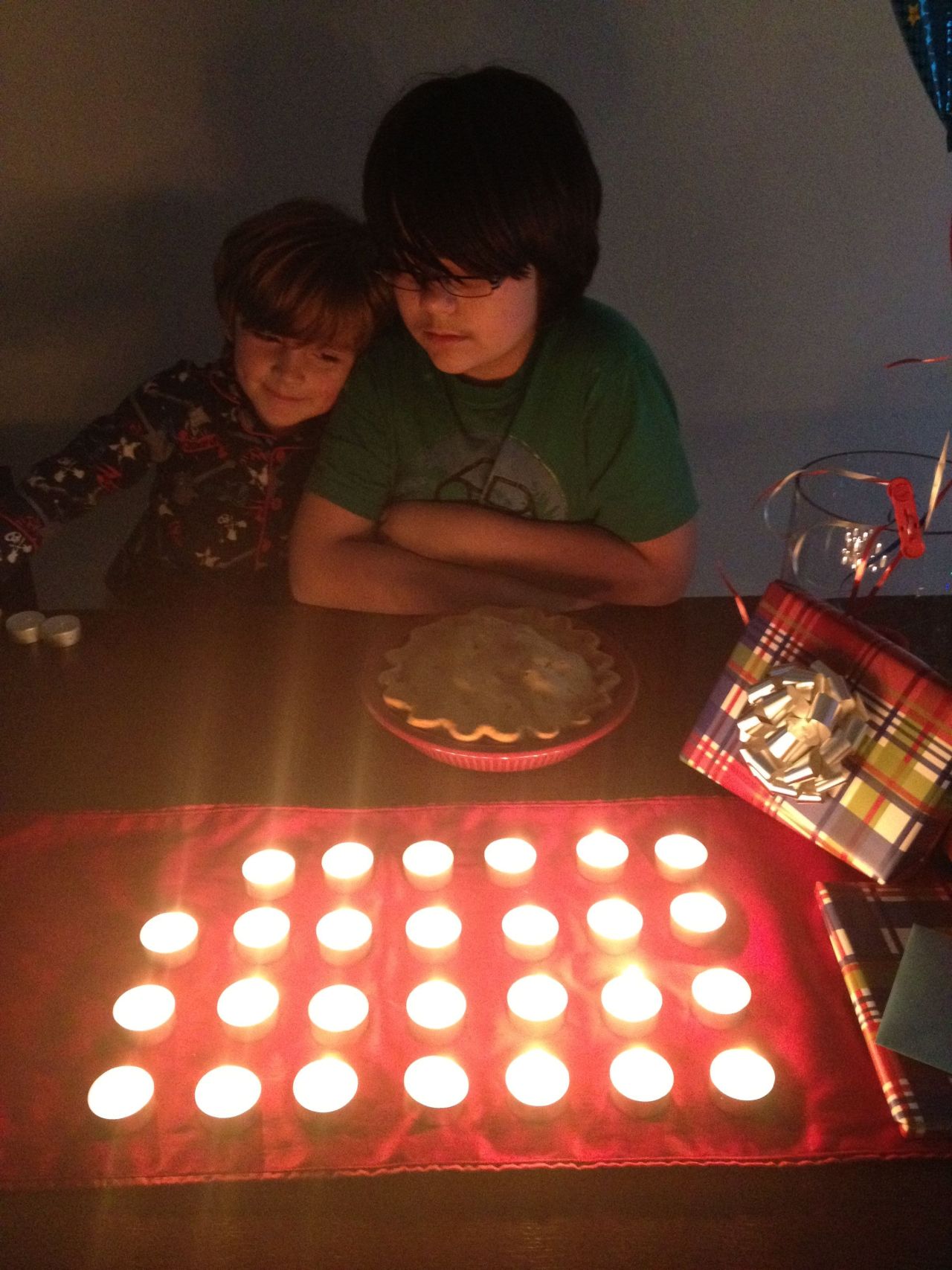 Jennifer Wallace's son replaced his 12 birthday candles with 27 tea lights in honor of those lost in Newtown. 