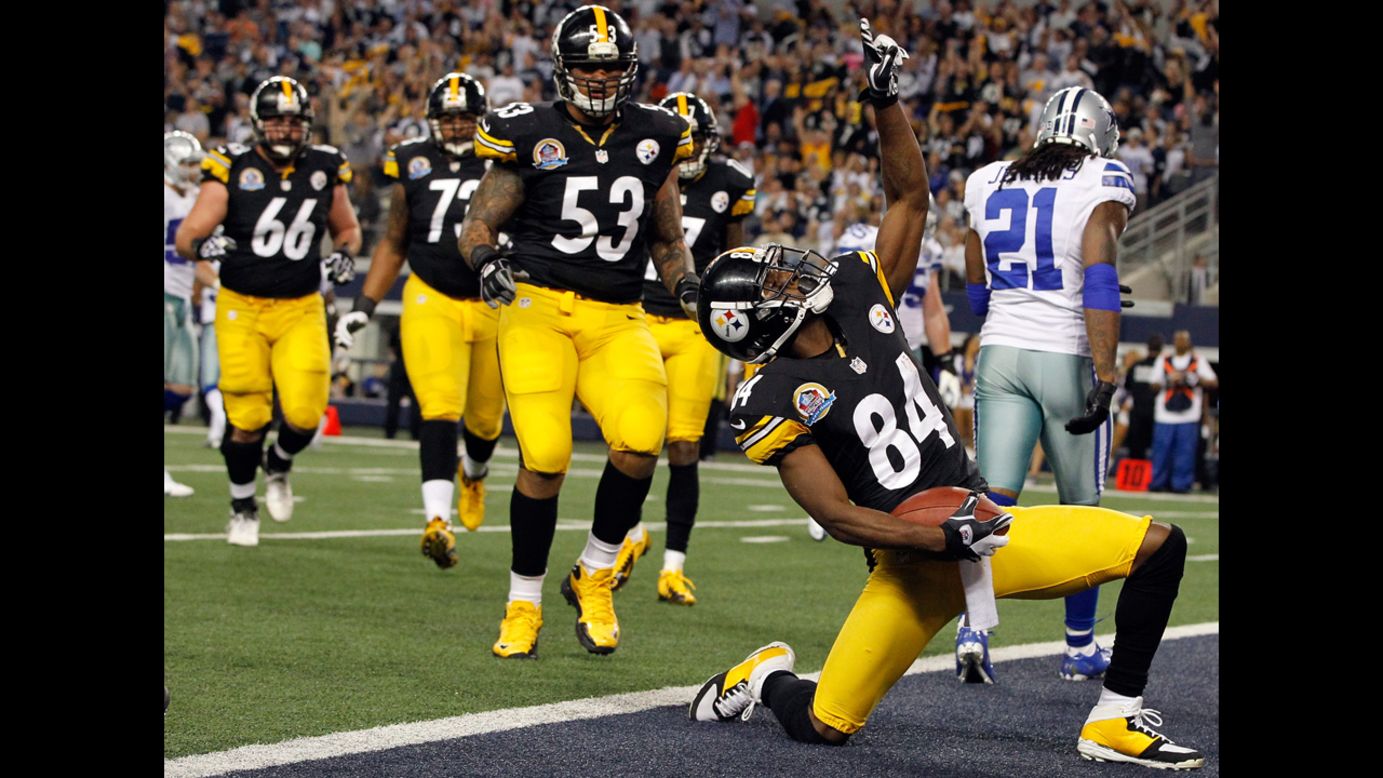 Antonio Brown of the Steelers celebrates after scoring a touchdown against Mike Jenkins of the Cowboys on Sunday.