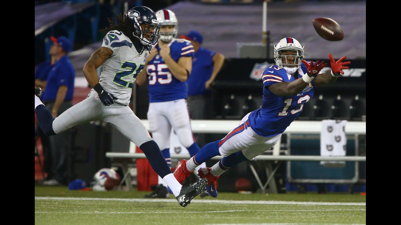 Stevie Johnson of the Bills cannot get to an overthrown pass as Richard Sherman of the Seahawks provides coverage on Sunday.
