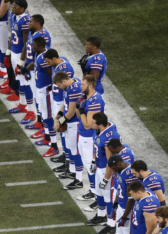 The Bills stand for a moment of silence Sunday before their game against the Seahawks to honor the memory of those killed in Friday's school shooting in Newtown, Connecticut.