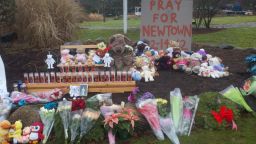 Ken Henggeler started this memorial to the victims of the shooting at the intersection of Main Street and Sugar Street in Newtown, Connecticut.  