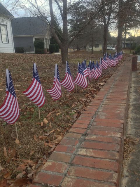 Mike Kirouac and his wife bought 27 flags they plan to place on their lawn every December 14. 